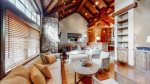Gorgeous wood beams and vaulted ceilings with stone accents